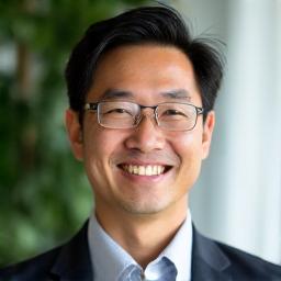 Professional headshot of Alex Chen, a calm and approachable man.